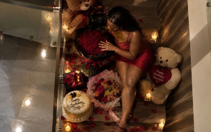 A birthday surprise of roses, teddy bears, a cake and gifts